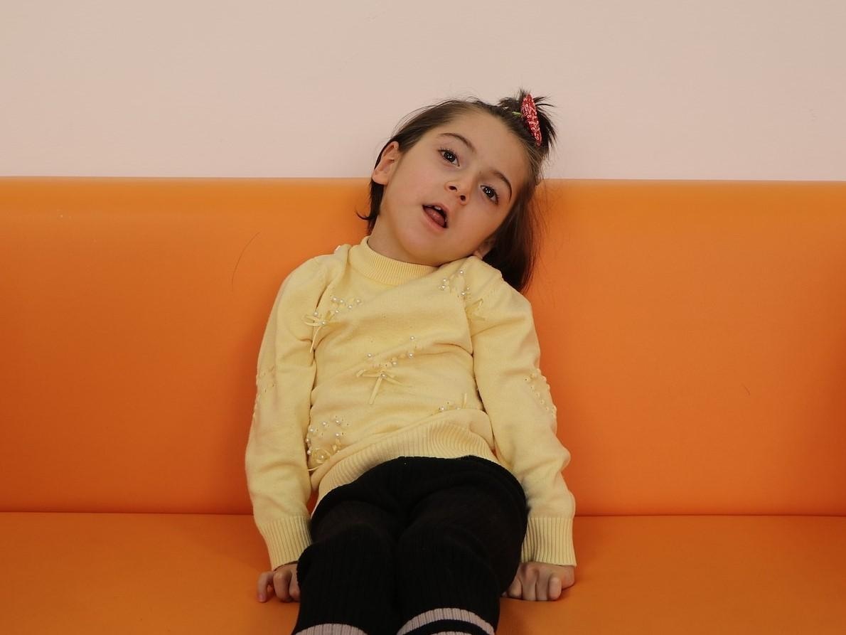 Aisha has cerebral palsy. She needs rehabilitation to learn to talk and walk!