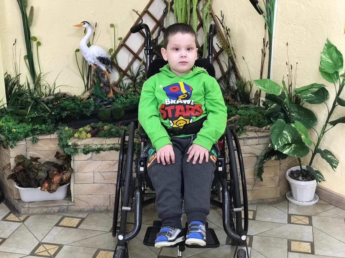 Dani has no support in his legs, so he needs an upright