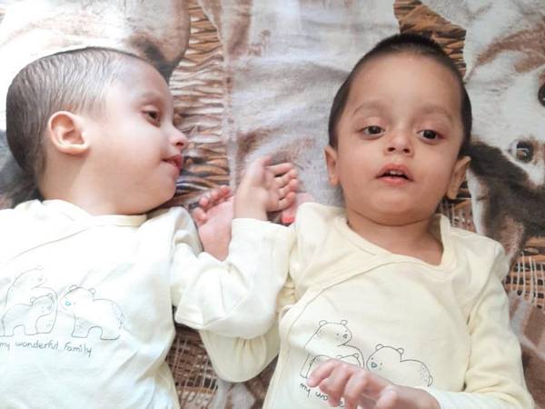 The twin brothers Kamal and Kalimulla need an expensive drug to treat a rare genetic disease