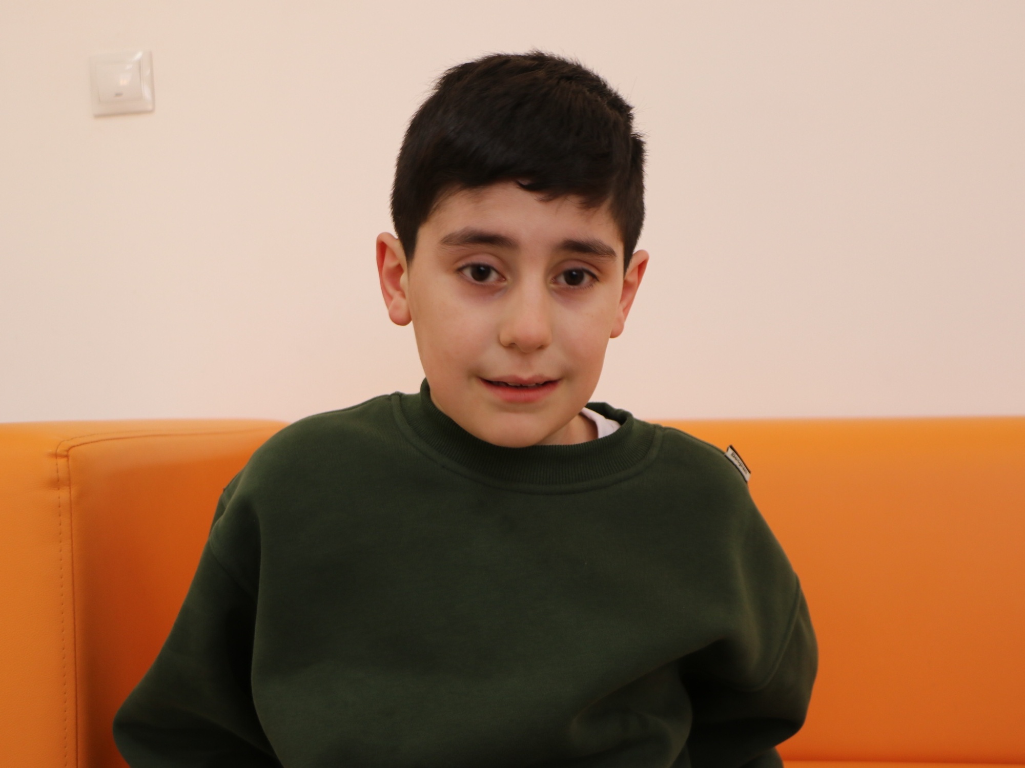 Help Muhammad, who has autism, learn to communicate and understand the world
