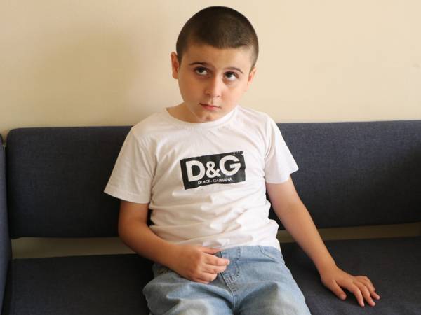 Khasan, who has cerebral palsy, is in need of rehabilitation