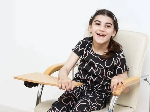 Maryam has cerebral palsy. In order to learn to walk, she needs to undergo rehabilitation.