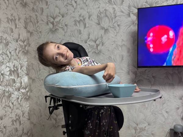 Alisa has cerebral palsy. She needs a tablet to communicate and to study