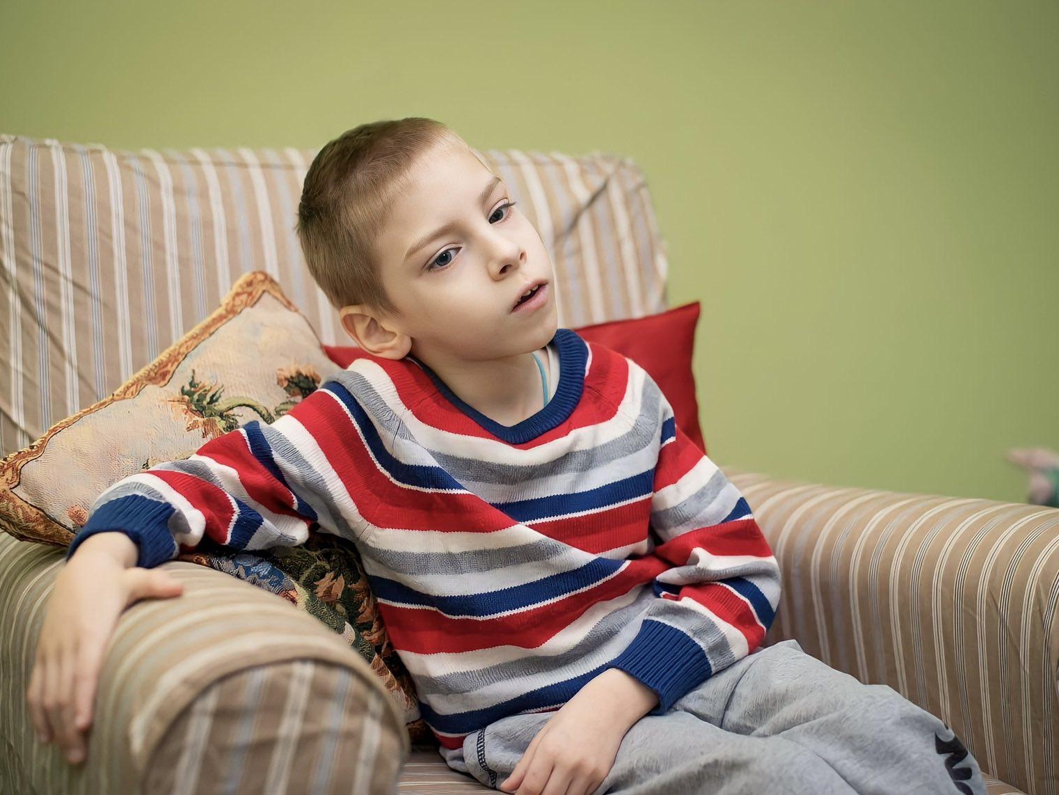 Elisha has cerebral palsy. He needs a verticalizer, To learn to walk