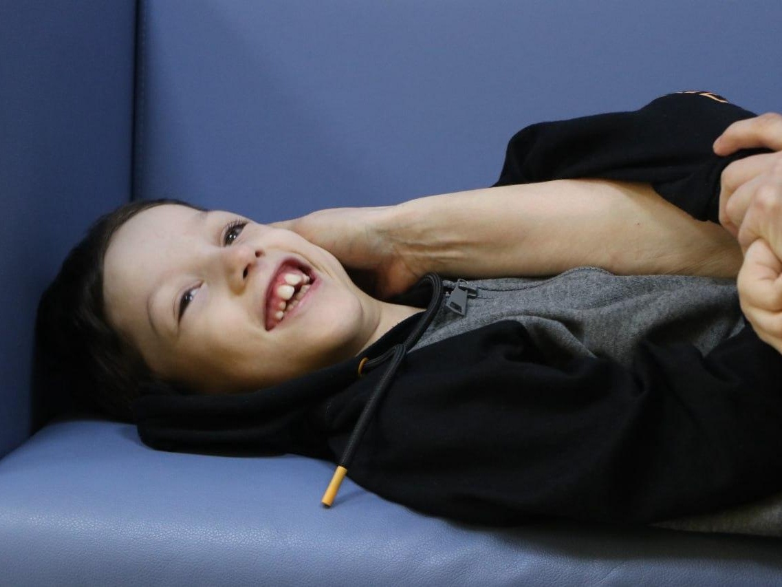 Sulumbek has cerebral palsy. He needs rehabilitation to develop his speech and motor skills!