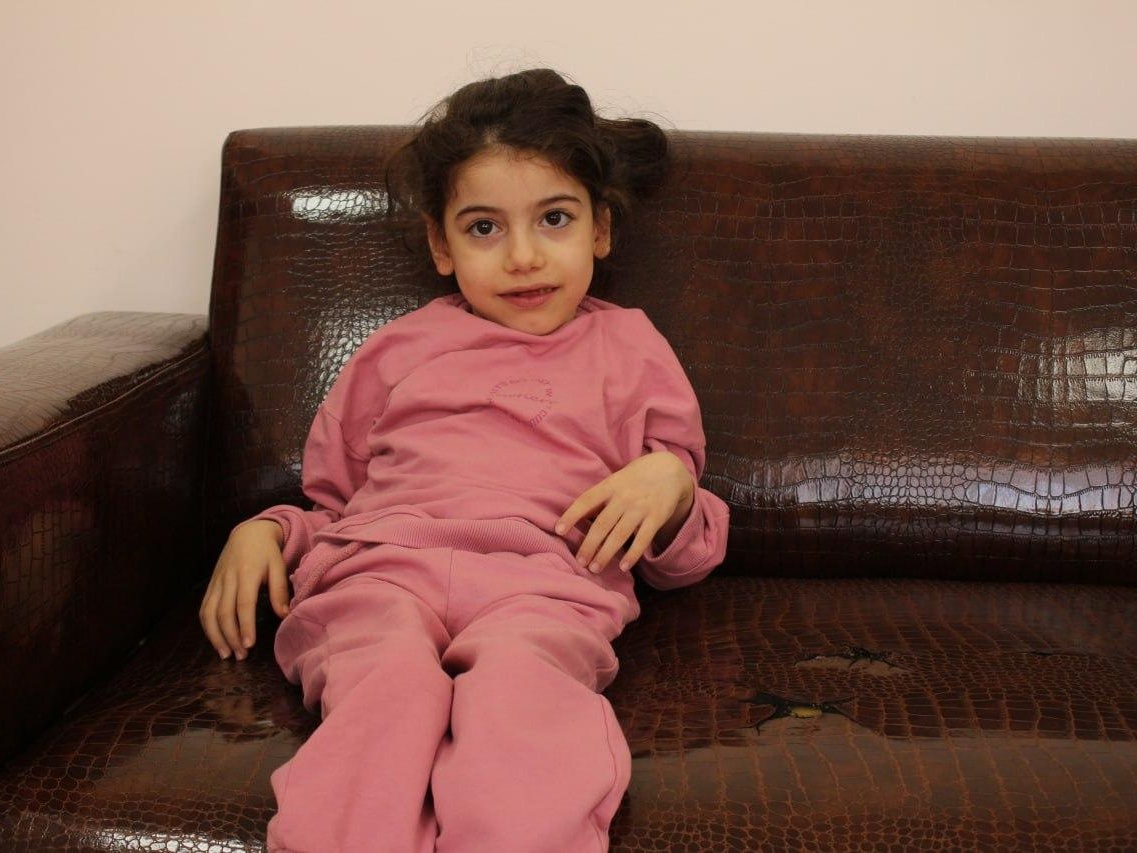 In order to learn to walk, Halima needs to buy an ankle brace and an ankle brace!