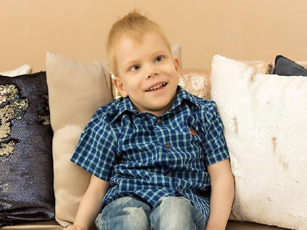 Maxim has cerebral palsy. He needs a specialized wheelchair to keep his body in the correct position