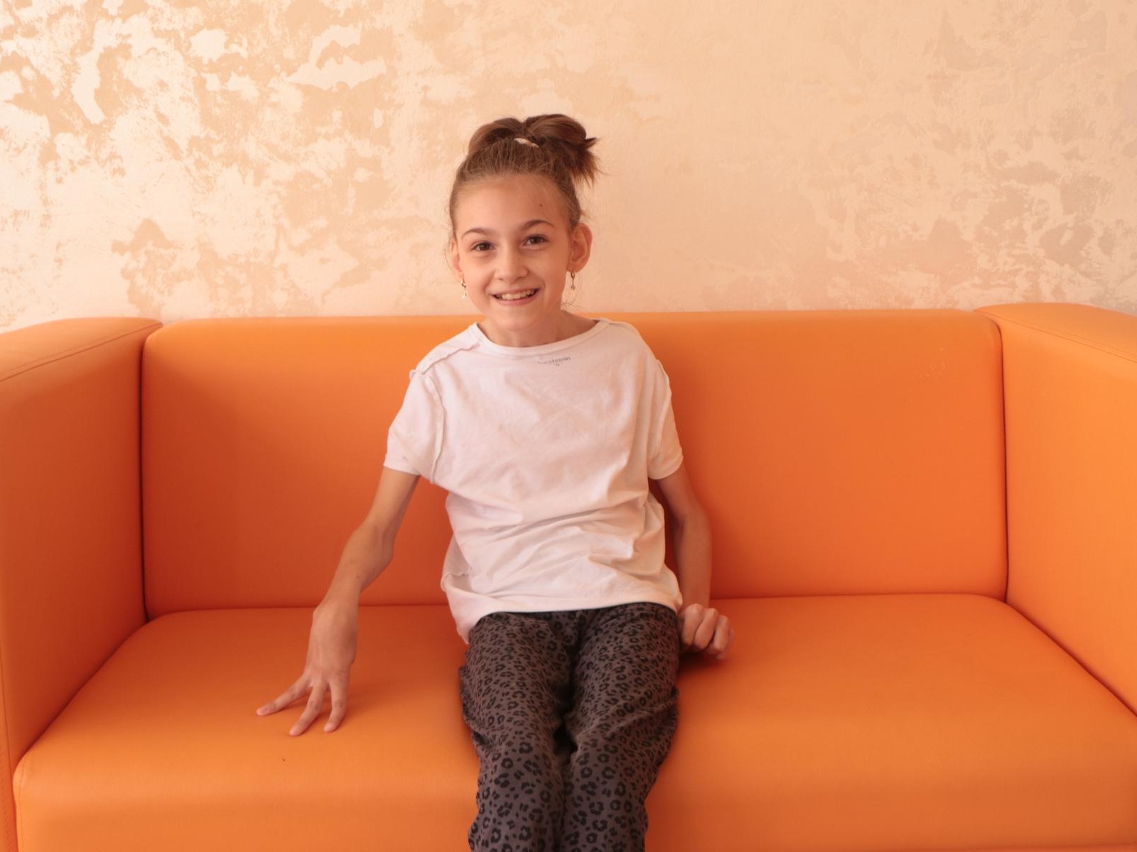 13-year-old Mackie has cerebral palsy. She needs help to continue rehabilitation.