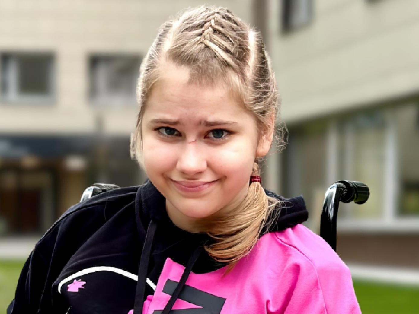 Due to a brain tumor, Olya is now in a wheelchair and needs rehabilitation
